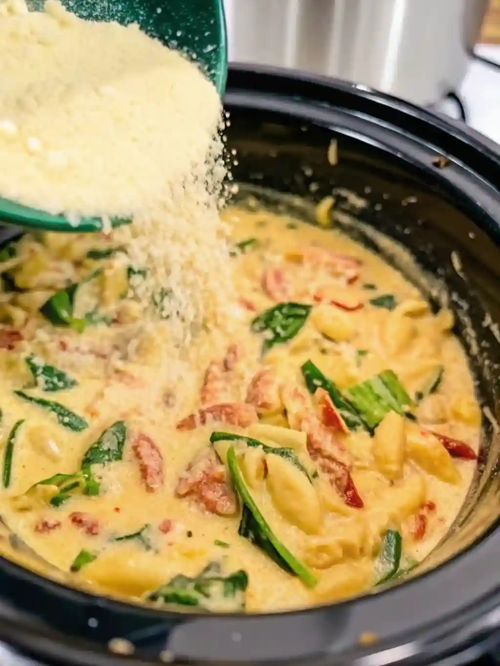 -marry-me-chicken-soup (1)_compressed Parmesan cheese being added to crockpot marry me chicken soup in the slow cooker