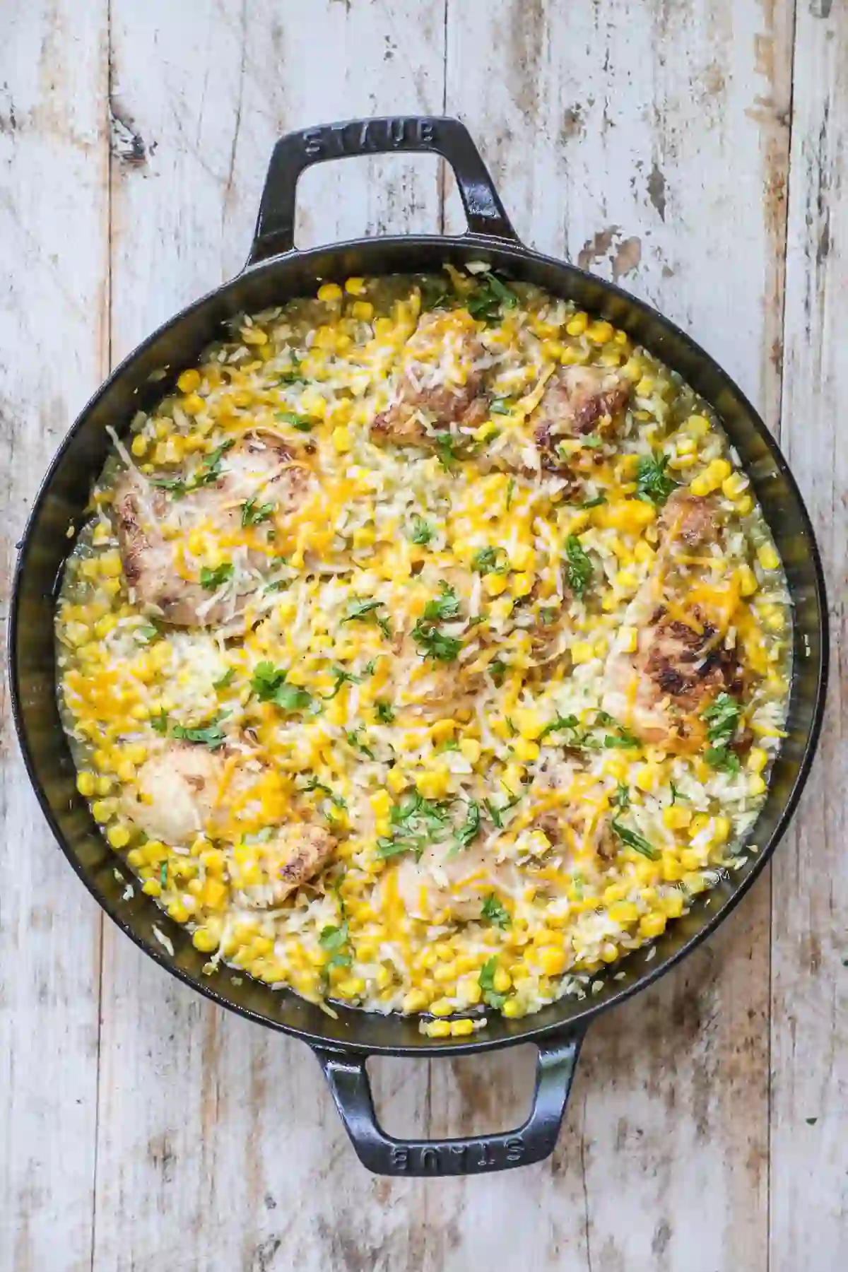 Chicken and rice skillet topped with melted cheese.