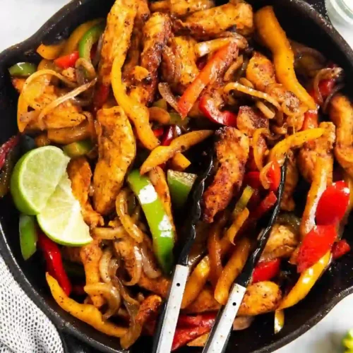 Easy Chicken Fajitas (Juicy, Flavor-Packed, Ready in 30 Minutes) 1 Chicken fajitas with peppers and onions combined in a cast-iron skillet