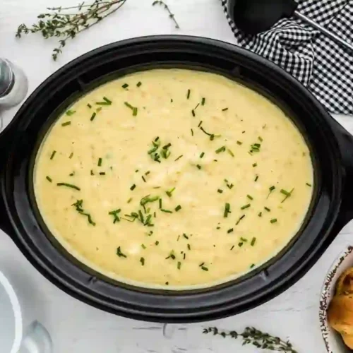 Slow Cooker Potato Leek Soup (Rich, Creamy & Foolproof) 1 Creamy slow cooker potato leek soup garnished with fresh chives