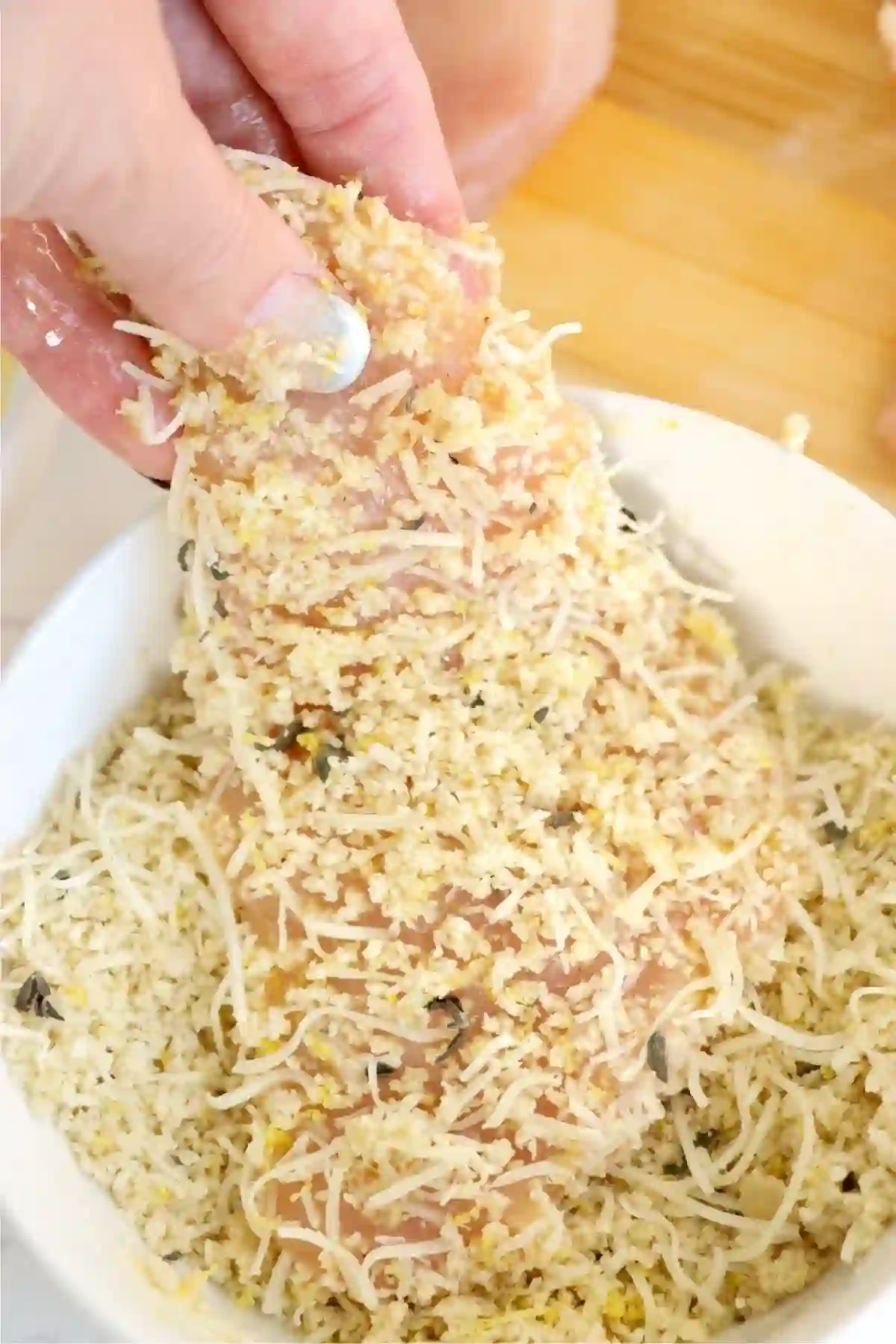 step-2-coat-chicken-breadcrumbs._compressed Chicken breast coated in breadcrumb mixture