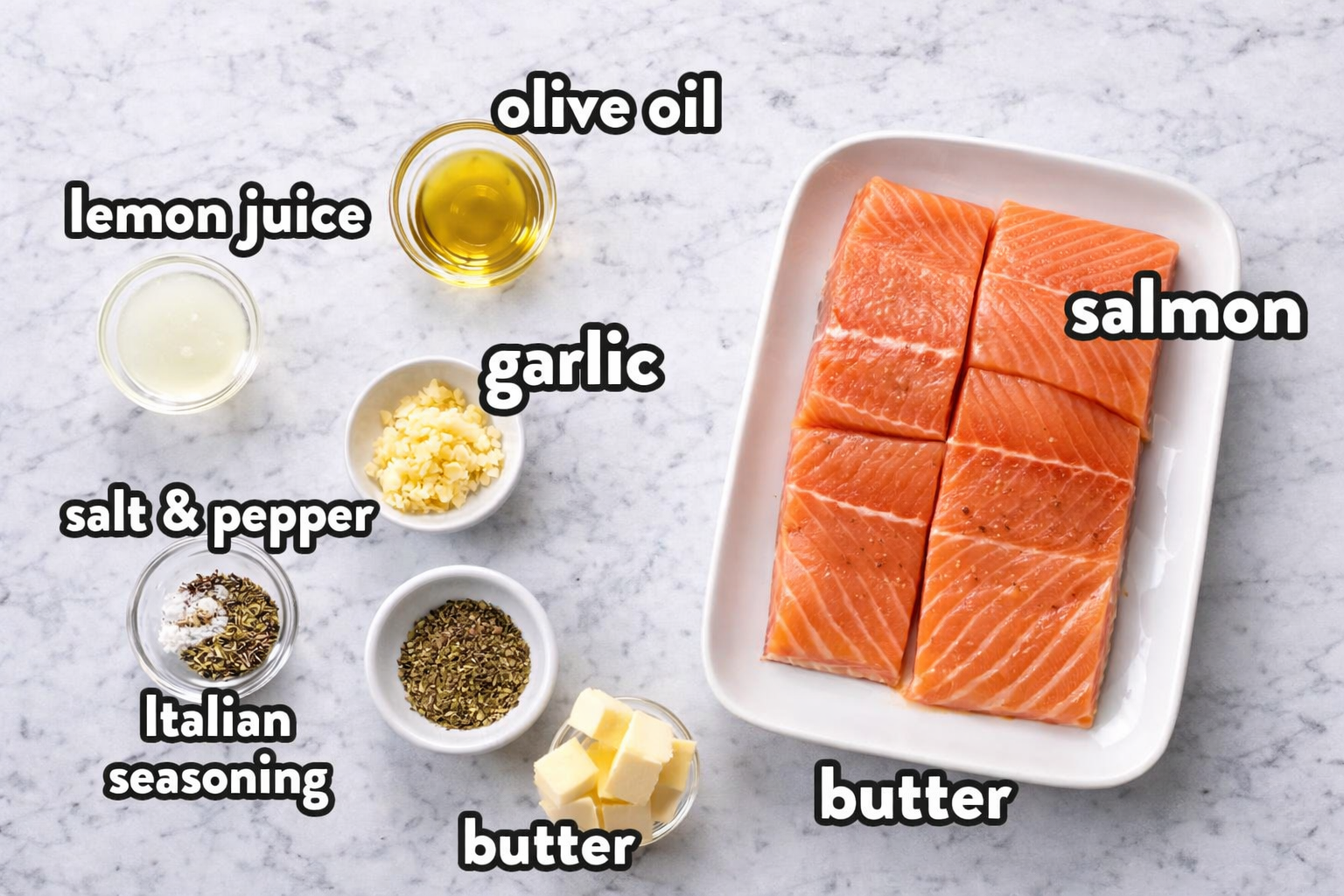 baked-salmon-lemon-butter-cream-sauce-ingredients. Ingredients for baked salmon with lemon butter cream sauce arranged on marble background