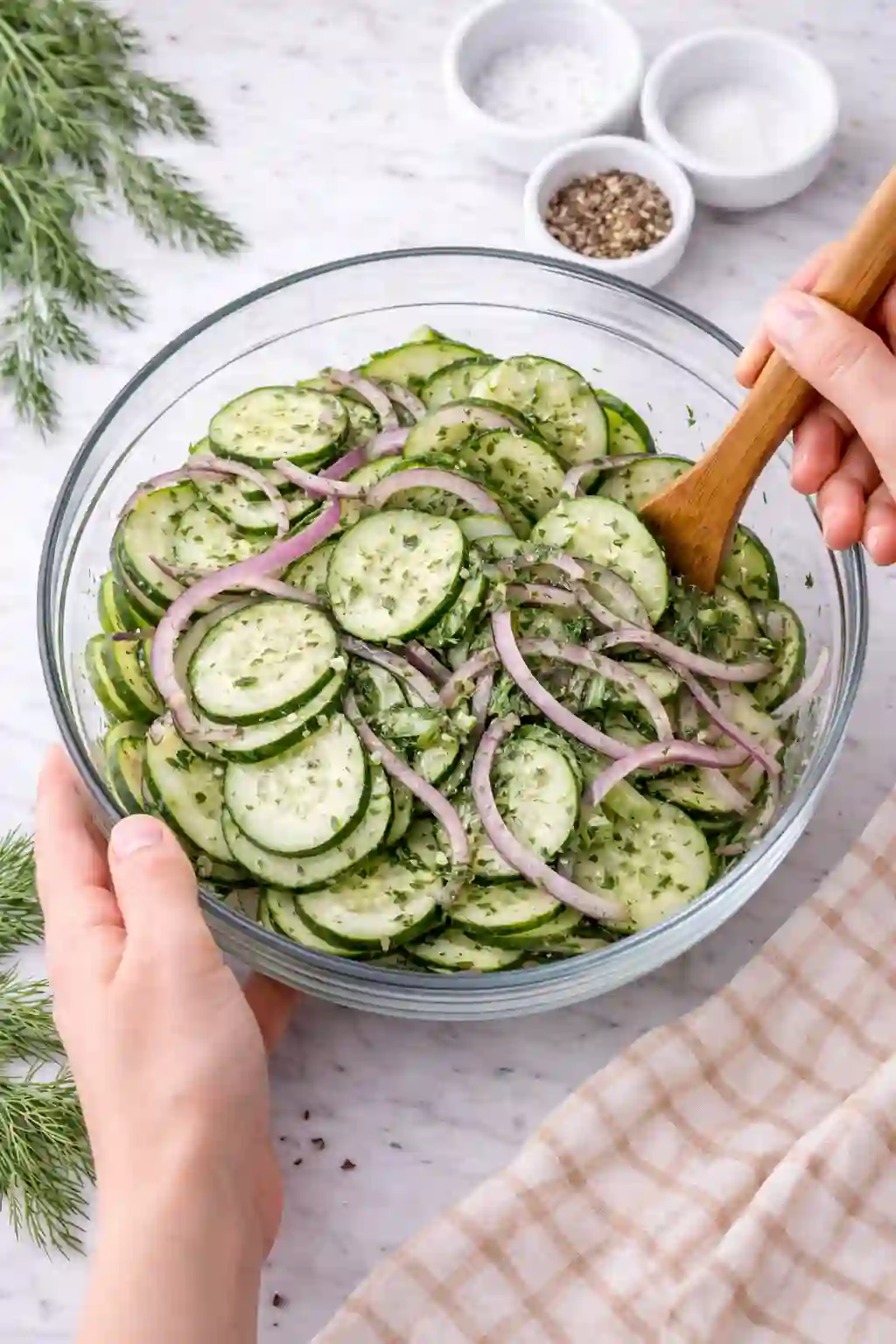 mix cucumber slices and onion evenly with dressing in bowl