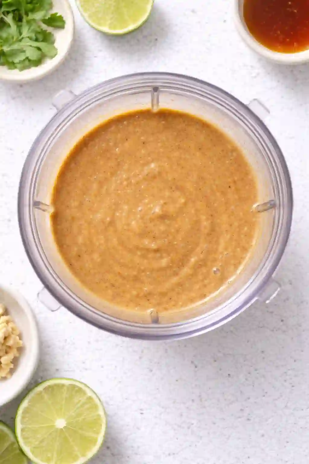 blending peanut ginger dressing in a small blender for crispy rice salad
