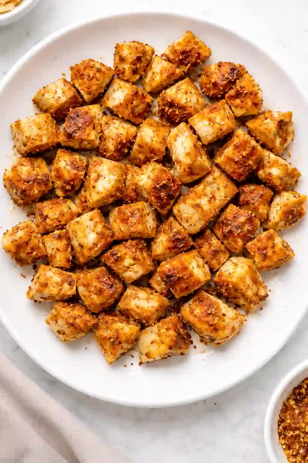 Roasted ras el hanout chicken thighs cut into cubes for dense bean salad