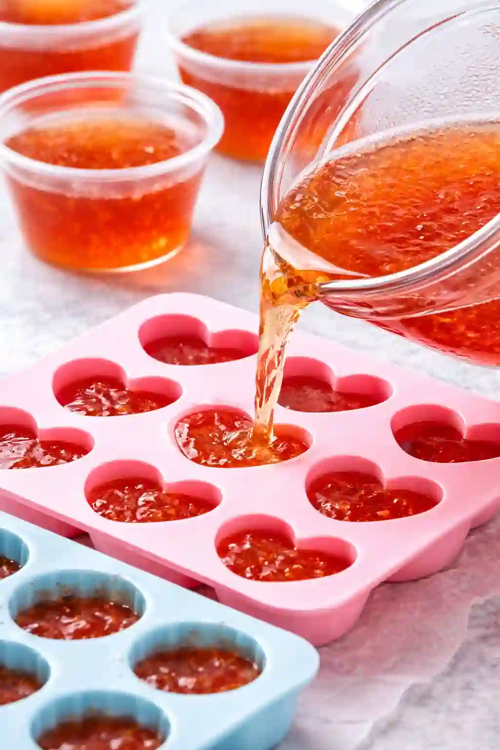 Pouring gelatin mixture into silicone molds and cups before chilling for bariatric gelatin recipe