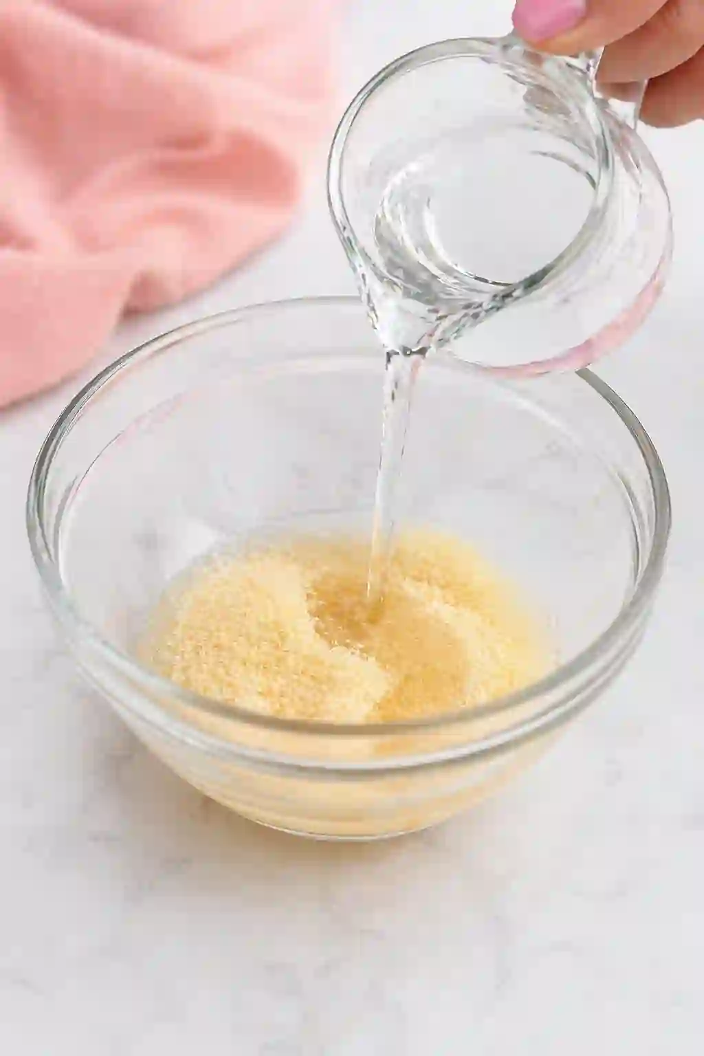 Blooming gelatin with cold water in a glass bowl for Dr Oz pink gelatin recipe for weight loss