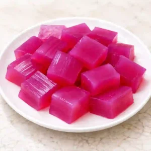 Dr Oz pink gelatin recipe for weight loss served as bright pink gelatin cubes on a white plate